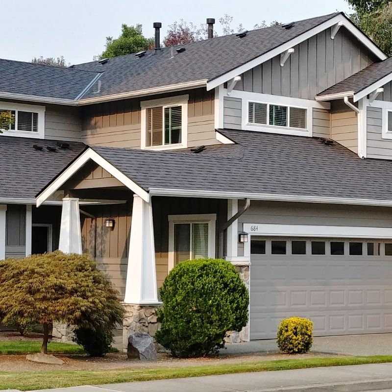 House with asphalt composition roofing