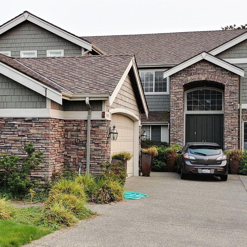 House with asphalt composition roofing